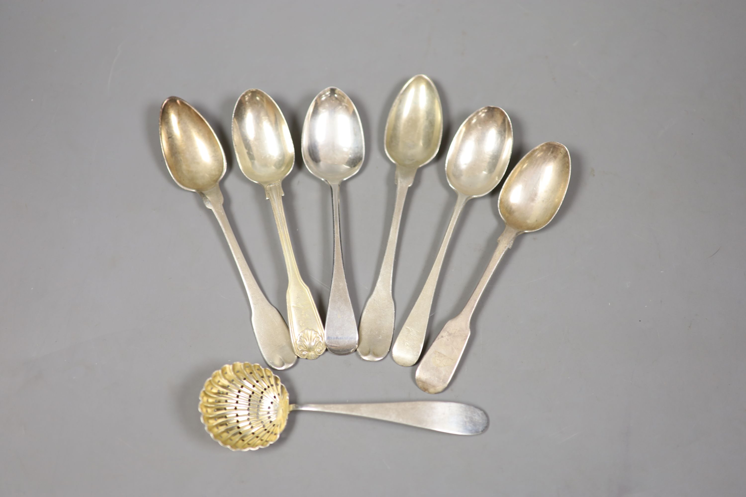 Seven assorted 19th century silver spoons including teaspoons and a sifter spoon, various dates and makers